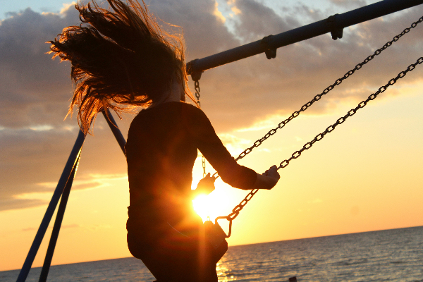 happiness and laughter on swing